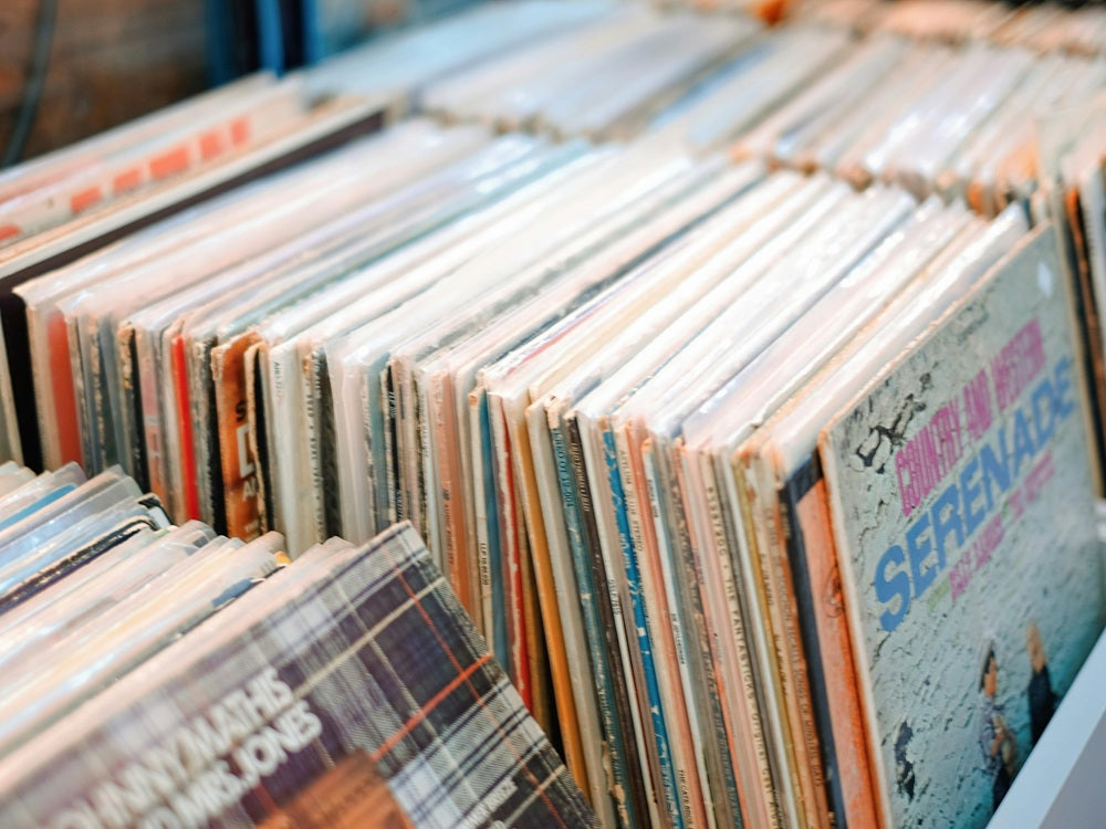 Stacks of vinyl - both pressed and custom lathe-cut