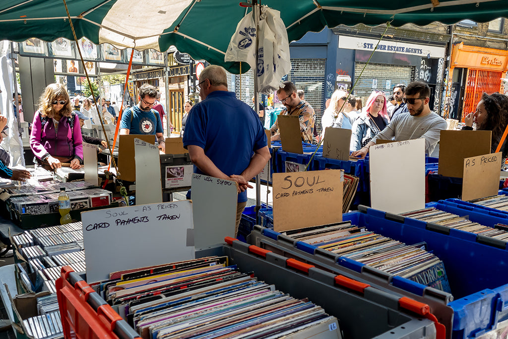 Tourists Visitors Browsing Brick Lane Market Stall Selling